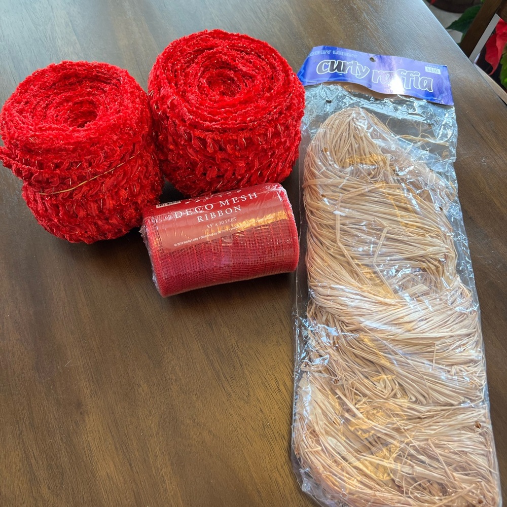 Decorating supplies including two kinds of ribbon and raffia